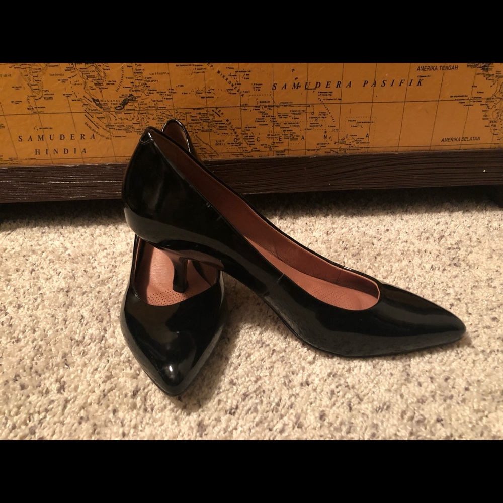Corso Como black patent leather pumps.